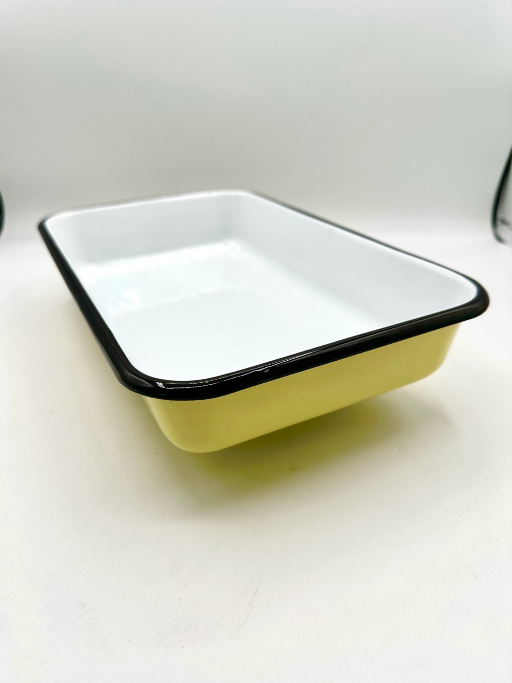 Enamel Bakeware coated pan. Yellow exterior, white inner & black trim.